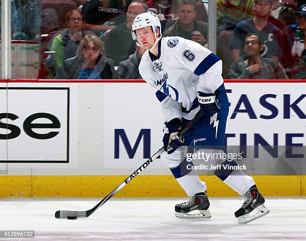 Anton Stralman of the Tampa Bay Lightning skates up ice with the puck during their NHL game against theVancouver Canucks at Rogers Arena October 18,...