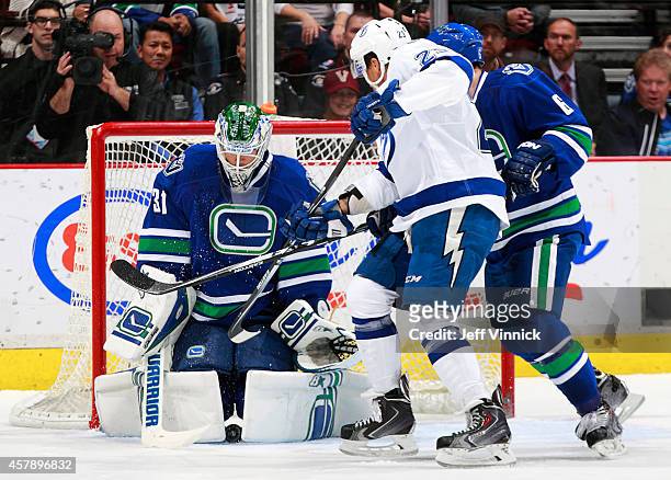 Eddie Lack of the Vancouver Canucks makes a save during their NHL game against the Tampa Bay Lightning at Rogers Arena October 18, 2014 in Vancouver,...