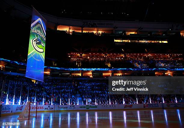 Hockey fans look on before the start of the NHL game between the Vancouver Canucks and the Tampa Bay Lightning at Rogers Arena October 18, 2014 in...