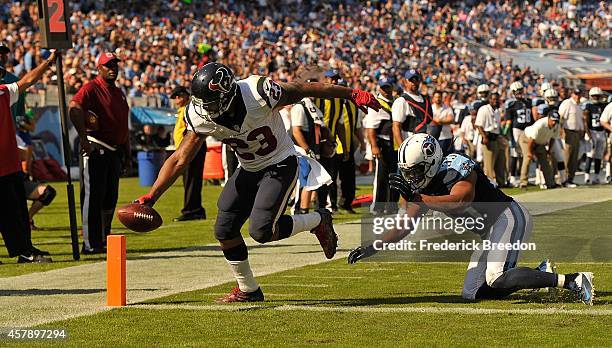 Running back Arian Foster of the Houston Texans scores a touchdown against Michael Griffin of the Tennessee Titans at LP Field on October 26, 2014 in...