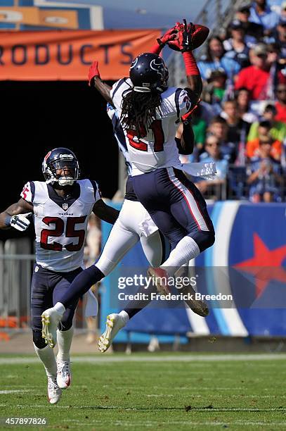 Kendrick Lewis of the Houston Texans jumps to make a catch against the Tennessee Titans at LP Field on October 26, 2014 in Nashville, Tennessee.