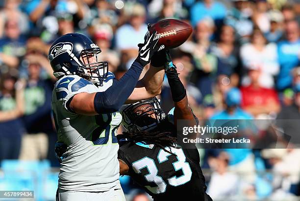 Luke Willson of the Seattle Seahawks catches the game winning touchdown against Tre Boston of the Carolina Panthers during the game at Bank of...