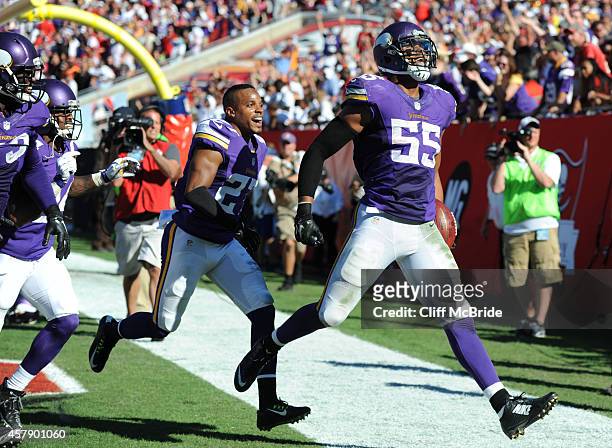 Outside linebacker Anthony Barr of the Minnesota Vikings celebrates his winning TD return with free safety Harrison Smith of the Minnesota Vikings in...