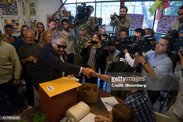 Jose Mujica, Uruguay's president, casts his ballot at a polling station in Montevideo, Uruguay, on Sunday, Oct. 26, 2014. Polls show the vote will...