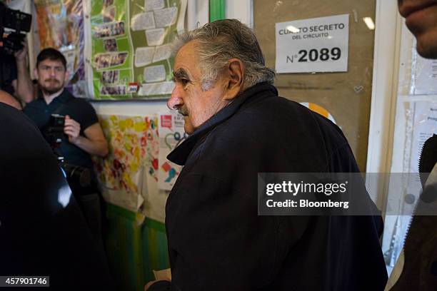 Jose Mujica, Uruguay's president, arrives at a polling station in Montevideo, Uruguay, on Sunday, Oct. 26, 2014. Polls show the vote will probably go...