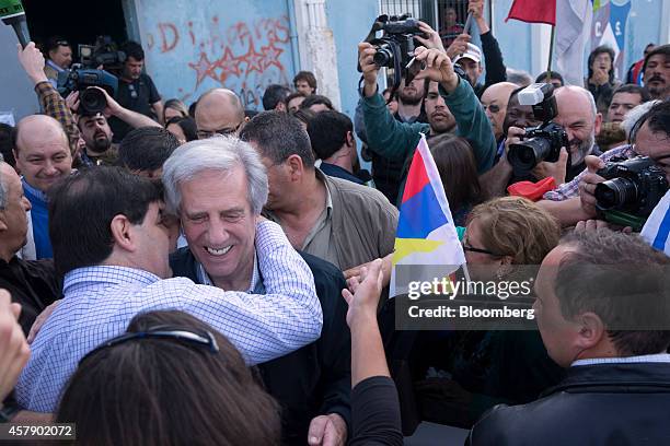 Presidential candidate Tabare Vazquez of the Broad Front party greets supporters after voting in Montevideo, Uruguay, on Sunday, Oct. 26, 2014. Polls...