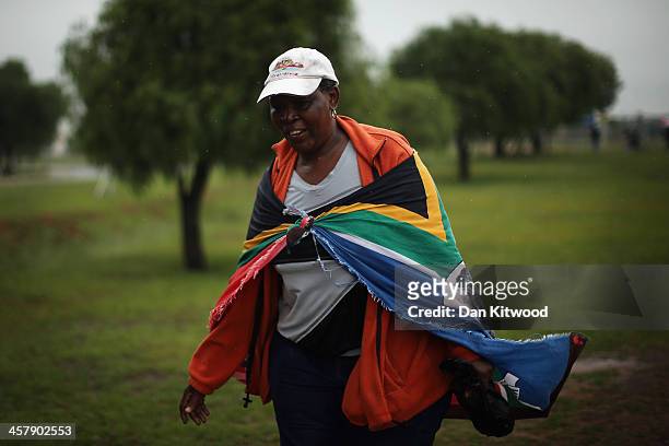 Members of the public walk towards the Nelson Mandela memorial service at the FNB Stadium, on December 10, 2013 in Johannesburg, South Africa. Over...