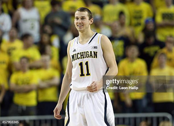 Nik Stauskas of the University of Michigan Wolverines drives the ball to the basket during the second half of the game against Houston Baptist...