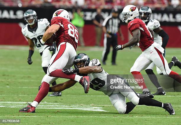 Tight end John Carlson of the Arizona Cardinals runs the football against strong safety Nate Allen of the Philadelphia Eagles in the first half of...