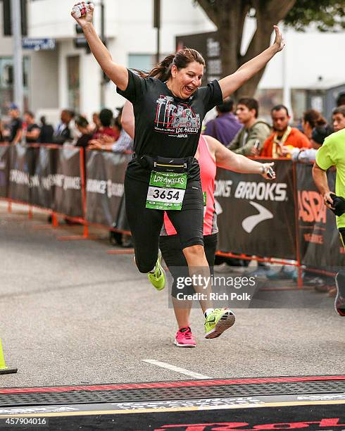 General view of a runner preparing to cross the finish line at the Rock 'n' Roll Los Angeles Halloween Half-Marathon and 5K benefitting the ASPCA on...