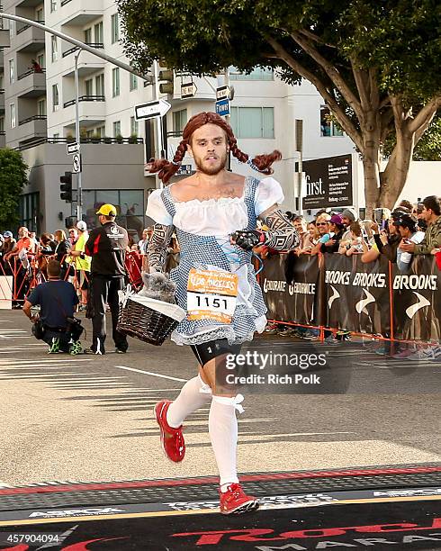 General view of a runner preparing to cross the finish line at the Rock 'n' Roll Los Angeles Halloween Half-Marathon and 5K benefitting the ASPCA on...