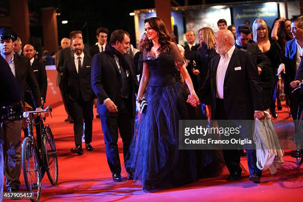 Maria Grazia Cucinotta and Renato Scarpa attend the 'Il Postino' Red Carpet during the 9th Rome Film Festival on October 26, 2014 in Rome, Italy.