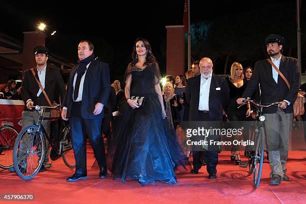 Maria Grazia Cucinotta, Renato Scarpa and Giulio Violati attend the 'Il Postino' Red Carpet during the 9th Rome Film Festival on October 26, 2014 in...