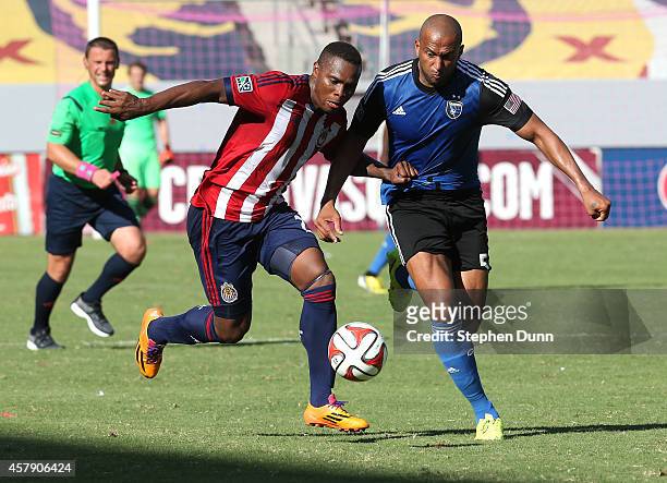 Felix Borja of Chivas USA and Victor Bernardez of the San Jose Earthquakes fight for the ball at StubHub Center on October 26, 2014 in Los Angeles,...