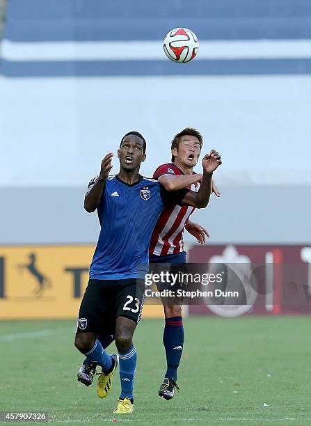 Akira Kaji of Chivas USA and Atiba Harris of the San Jose Earthquakes fight for the ball at StubHub Center on October 26, 2014 in Los Angeles,...