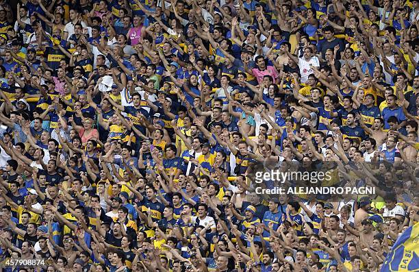 Supporters of Boca Juniors cheers their team during their Argentine First Division football match against Defensa y Justicia, at the Bombonera...