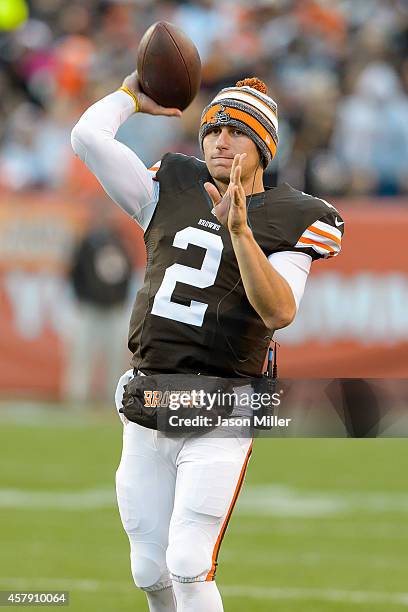 Quarterback Johnny Manziel of the Cleveland Browns throws a warm up pass during a timeout during the second half against the Oakland Raiders at...