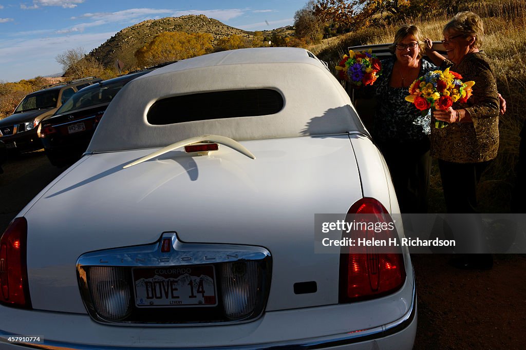 Gay couple officially get married at the Chapel at Red Rocks near Red Rocks Park in Morrison, CO.