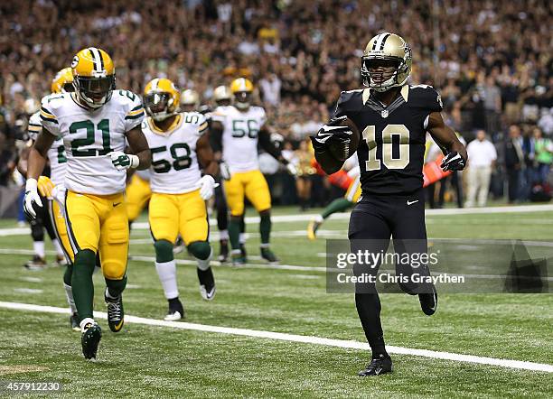 Brandin Cooks of the New Orleans Saints runs the ball in for a touchdown against the Green Bay Packers during the first quarter at Mercedes-Benz...