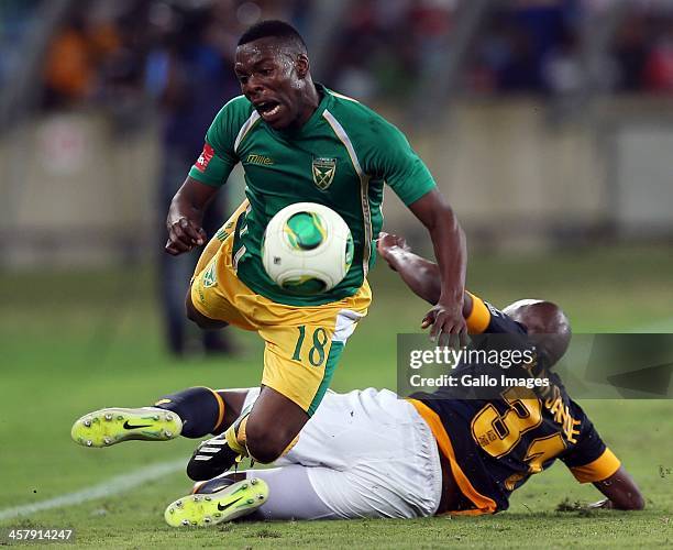 Wiyanda Zwane of Lamontville Golden Arrows is tackled by Willard Katsande of Kaizer Chiefs during the Absa Premiership match between Golden Arrows...