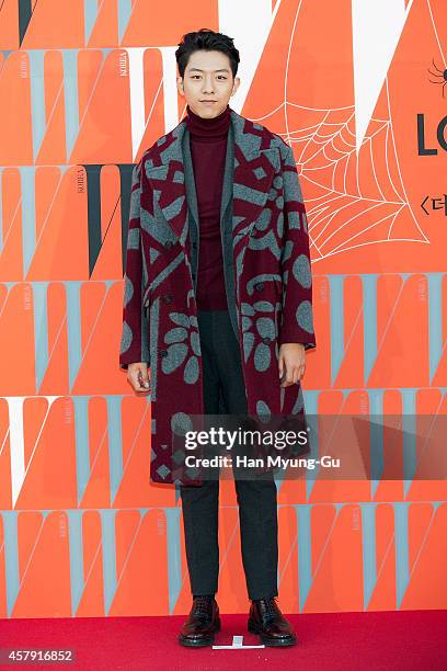 Lee Jung-Shin of South Korean boy band CNBLUE poses for photographs at the W Magazine Korea Breast Cancer Awareness Campaign "Love Your W" photo call...