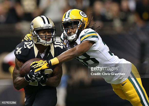 Brandin Cooks of the New Orleans Saints catches the ball for a touchdown as Tramon Williams of the Green Bay Packers defends during the second...