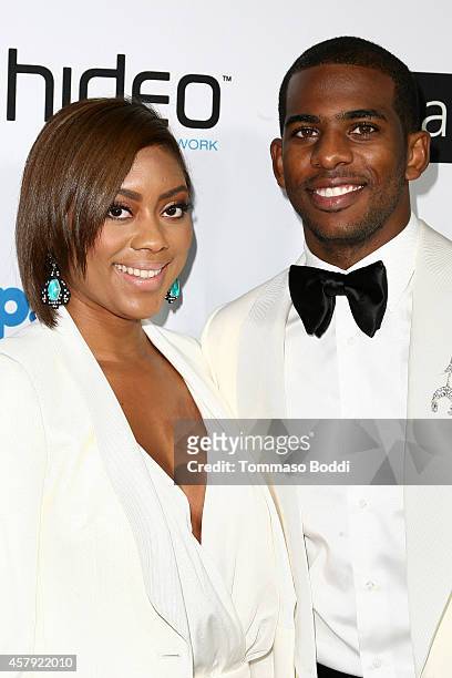 Basketball player Chris Paul and Jada Crawley attend the CP3 Foundation celebrity server dinner at Mastro's Steakhouse on October 26, 2014 in Beverly...