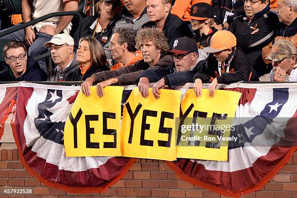 Fans are seen holding three Yes signs in the stand during Game 5 of the 2014 World Series between the San Francisco Giants and the Kansas City Royals...