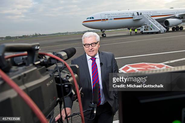 German Foreign Minister Frank-Walter Steinmeier is interviewed at Orly Aiport prior to his flight to Abuja, Nigeria October 26, 2014 in Paris,...