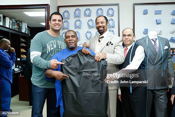 Former Jets Player Anthony Becht, basketball player Walt "Clyde" Frasier , Mohan Ram chandani and member of the Doe fund and recipient of a suit...