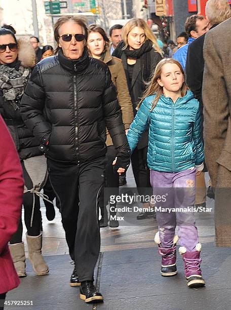 Musician Sir Paul McCartney and his daughter, Beatrice McCartney, are seen on December 19, 2013 in New York City.