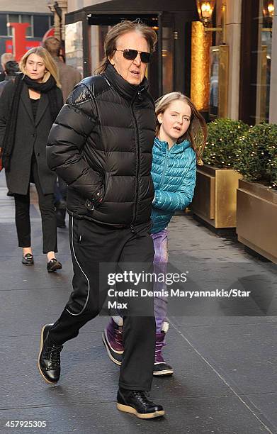 Musician Sir Paul McCartney and his daughter, Beatrice McCartney, are seen on December 19, 2013 in New York City.