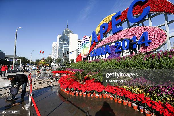 Worker arranges flower terrace to welcome Asia-Pacific Economic Cooperation at Changan Avenue on October 26, 2014 in Beijing, China. Flowers in the...