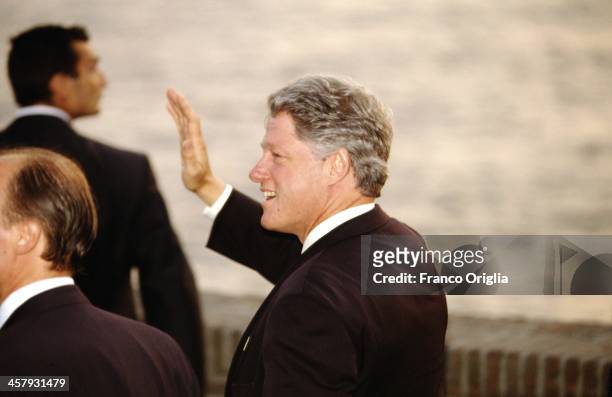42nd President of the United States Bill Clinton waves during a working dinner for the international leaders at Castel dell'Ovo on the first night of...