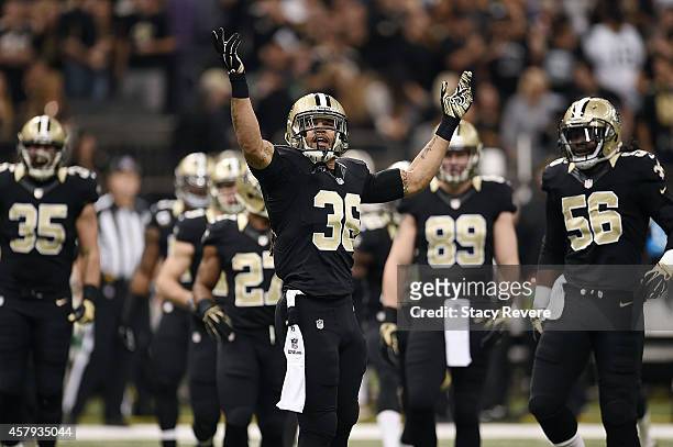 Marcus Ball of the New Orleans Saints urges the crowd to cheer during a game against the Green Bay Packers at the Mercedes-Benz Superdome on October...