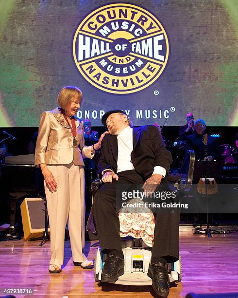 Jo Walker Meador presents Mac Wisemanwith his CMHOF medallion during the 2014 Country Music Hall of Fame induction ceremony at Country Music Hall of...
