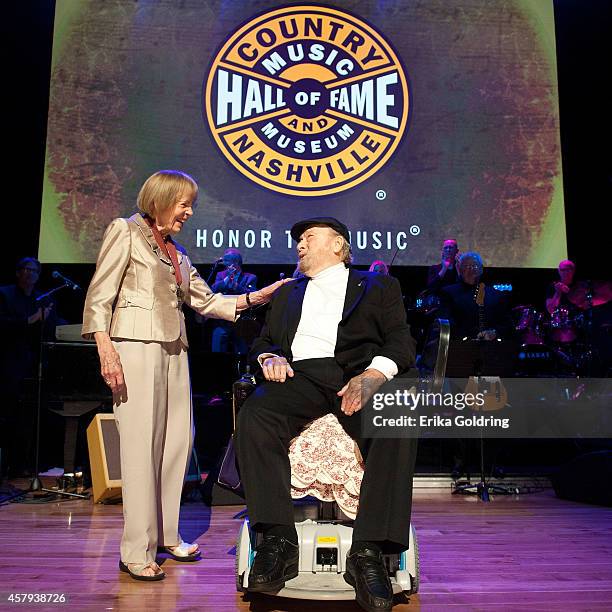 Jo Walker Meador presents Mac Wisemanwith his CMHOF medallion during the 2014 Country Music Hall of Fame induction ceremony at Country Music Hall of...
