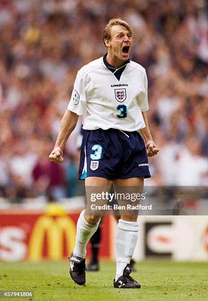 Stuart Pearce of England celebrates after scoring his penalty during the 1996 European soccer championship match between England and Spain at Wembley...