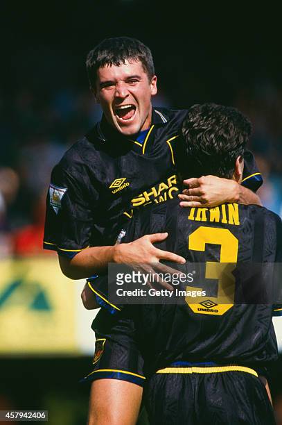 Manchester United players Roy Keane celebrates with Denis Irwin after Irwin had scored during the FA Carling Premiership match between Southampton...