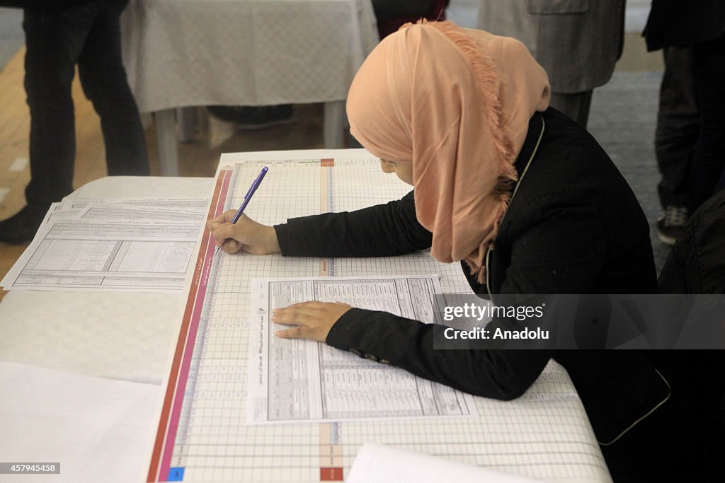 Tunisian Officials Counting Ballots in Parliament Vote