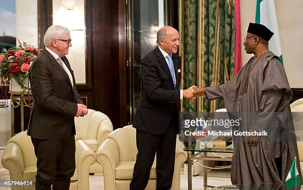 German Foreign Minister Frank-Walter Steinmeier and French Foreign Minister Laurent Fabius meet Nigerias President Goodluck Jonathan on October 27,...