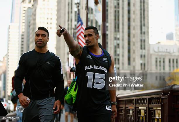 Victor Vito and Jerome Kaino of the New Zealand All Blacks take in a bit of sightseeing as they walk along Michigan Ave following a pool recovery...