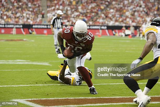 Bryant Johnson of the Arizona Cardinals runs through the tackle of Ike Taylor of the Pittsburgh Steelers during a game on August 12, 2006 at the...