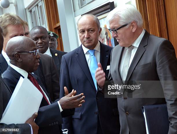 Nigerian Foreign Affairs Minister Aminu Wali speaks with French Foreign Affairs Minister Laurent Fabius and his German counterpart Frank-Walter...