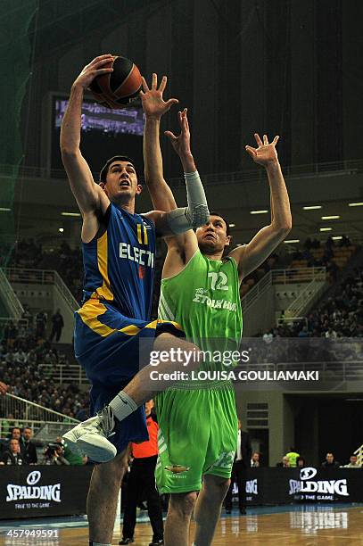 Panathinaikos Athens' Loukas Mavrokefalidis tries to stop Maccabi Tel Aviv's Jake Cohen during their Euroleague basketball match at the Olympic...