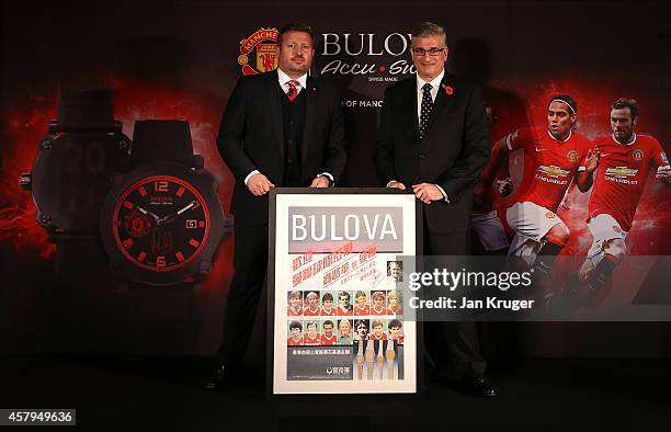 Bulova Corporation President Gregory Thumm and Manchester United Group Managing Director Richard Arnold pose during the Bulova AccuSwiss Squad Watch...