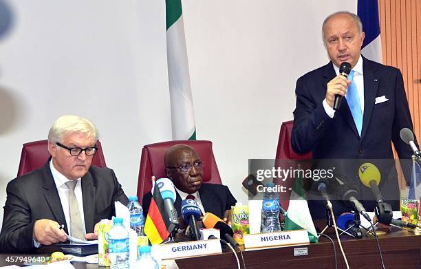 French Foreign Minister Laurent Fabius speaks while Nigerian Foreign Affairs Minister Aminu Wali and their German counterpart Frank-Walter Steinmeier...