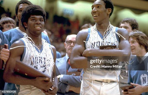 Tournament: North Carolina Phil Ford and Walter Davis victorious wearing nets around necks after winning game and tournament vs North Carolina State...