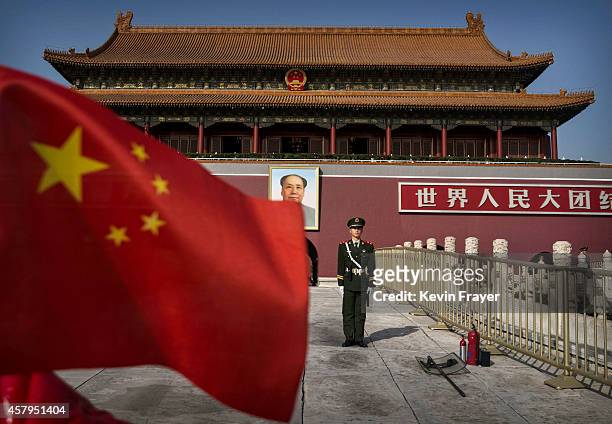 Chinese soldier stands guard in front of Tiananmen Gate outside the Forbidden City on October 27, 2014 in Beijing, China.