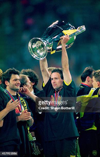 Borussia Dortmund player Paul Lambert raises the trophy after the UEFA Champions League final between Borussia Dortmund and Juventus at the Olympic...